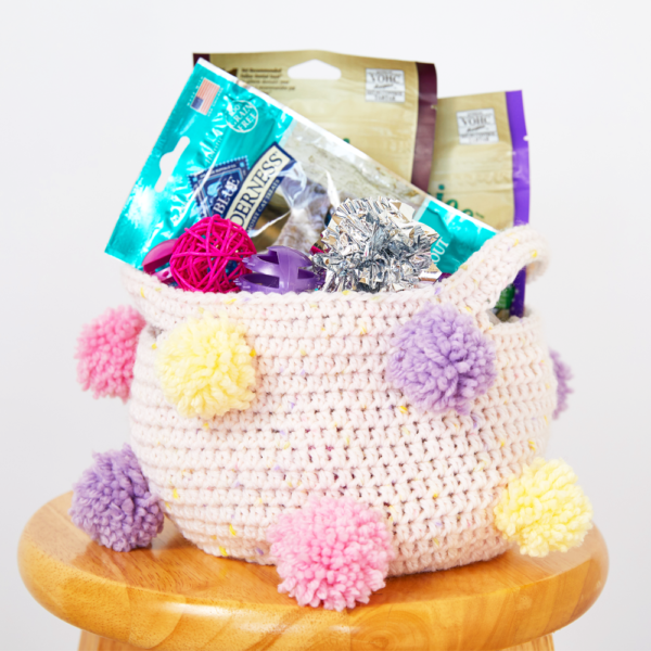If you’re looking for an easy way to create more storage for a room, this Pom Pom Storage Basket is perfect. #crochetbasket #crochetpattern #crochetlove #crochetaddict