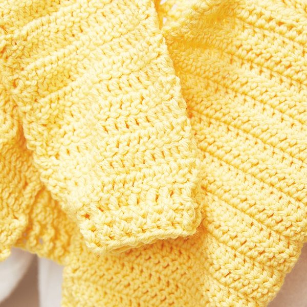 This crochet sweater is perfect to wear to Easter dinner or to hunt eggs at the local park. Your little one will love this free crochet pattern. #KidsCrochetSweater #CrochetCardigan #CrochetPattern #CrochetAddict