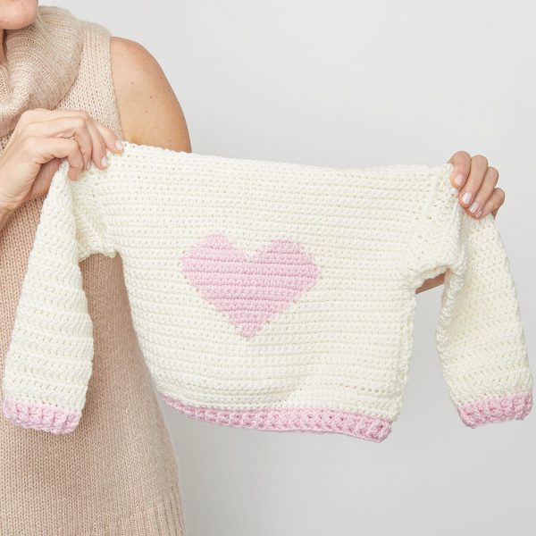 If you want to crochet for kids in your life, this little crochet sweater will make a great project. Start having fun with the Children’s Heart Sweater. #CrochetSweater #CrochetSweaterPatterns #CrochetingForBeginners