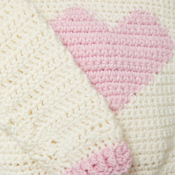 If you want to crochet for kids in your life, this little crochet sweater will make a great project. Start having fun with the Children’s Heart Sweater. #CrochetSweater #CrochetSweaterPatterns #CrochetingForBeginners