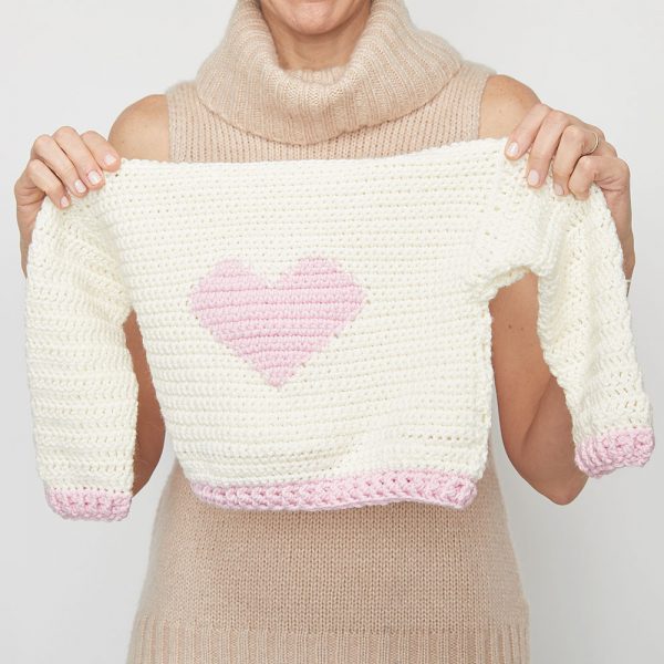 If you want to crochet for kids in your life, this little crochet sweater will make a great project. Start having fun with the Children’s Heart Sweater. #CrochetSweater #CrochetSweaterPatterns #CrochetingForBeginners