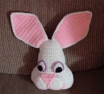 Small Easter Bunny Pillow - These crochet pillows are fun and an adventure to make. If you’re looking for creative kids pillows, this list will be your go to. #CrochetPillowPatterns #CrochetPatterns #CrochetAddict