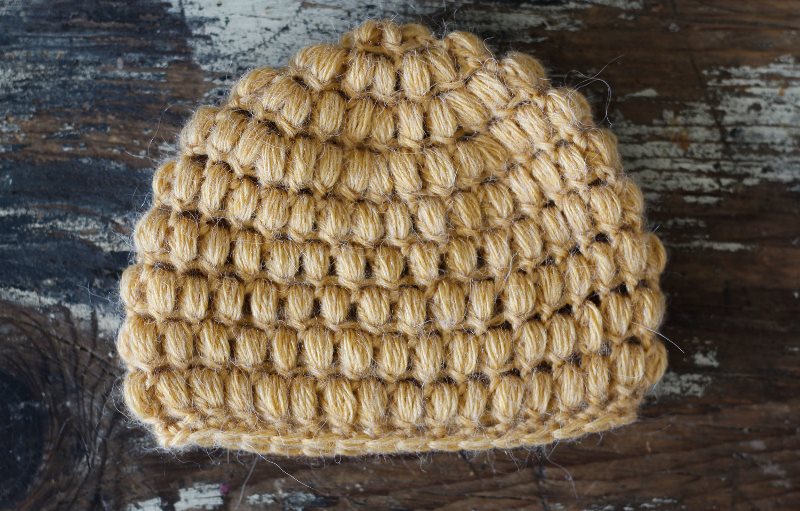 Puff Stitch Hat - These free newborn crochet hat patterns are fun and easy to work on. These baby accessories are so fast to make and anyone can do it. #CrochetBabyHatPatterns #CrochetHatPatterns #CrochetNewbornHats