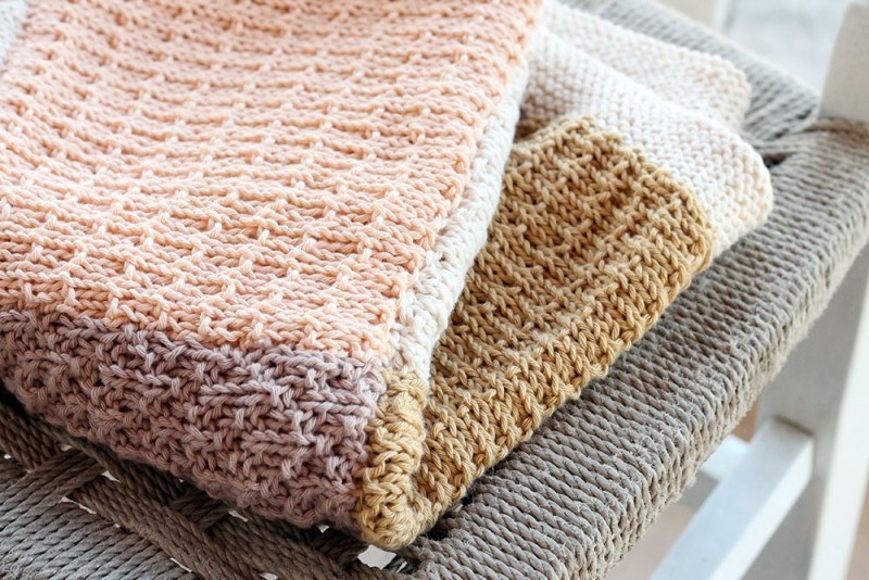 Knitted Baby Blanket - Each of these baby blanket knitting patterns is suitable for any skill level and is fun to make. The best part is how colorful they all are and how versatile. #BabyBlanketKnittingPatterns #KnitBabyBlankets #FreeKnitPatterns