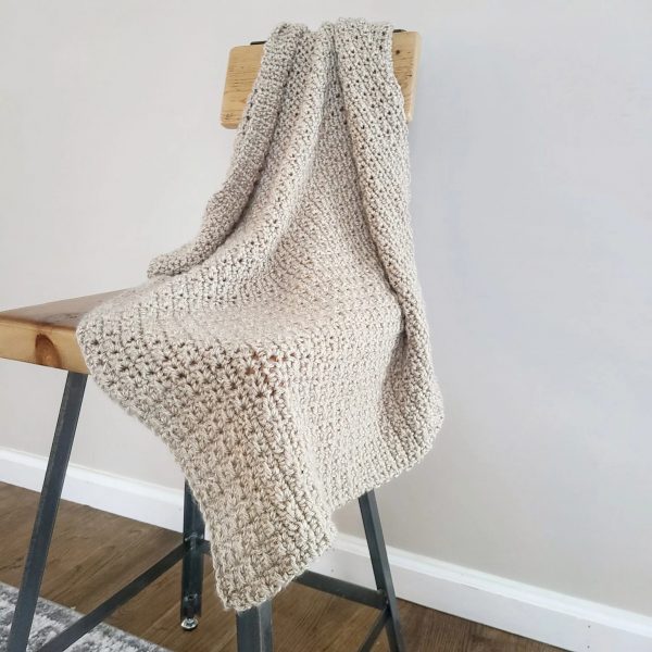 finley crochet blanket  on a chair